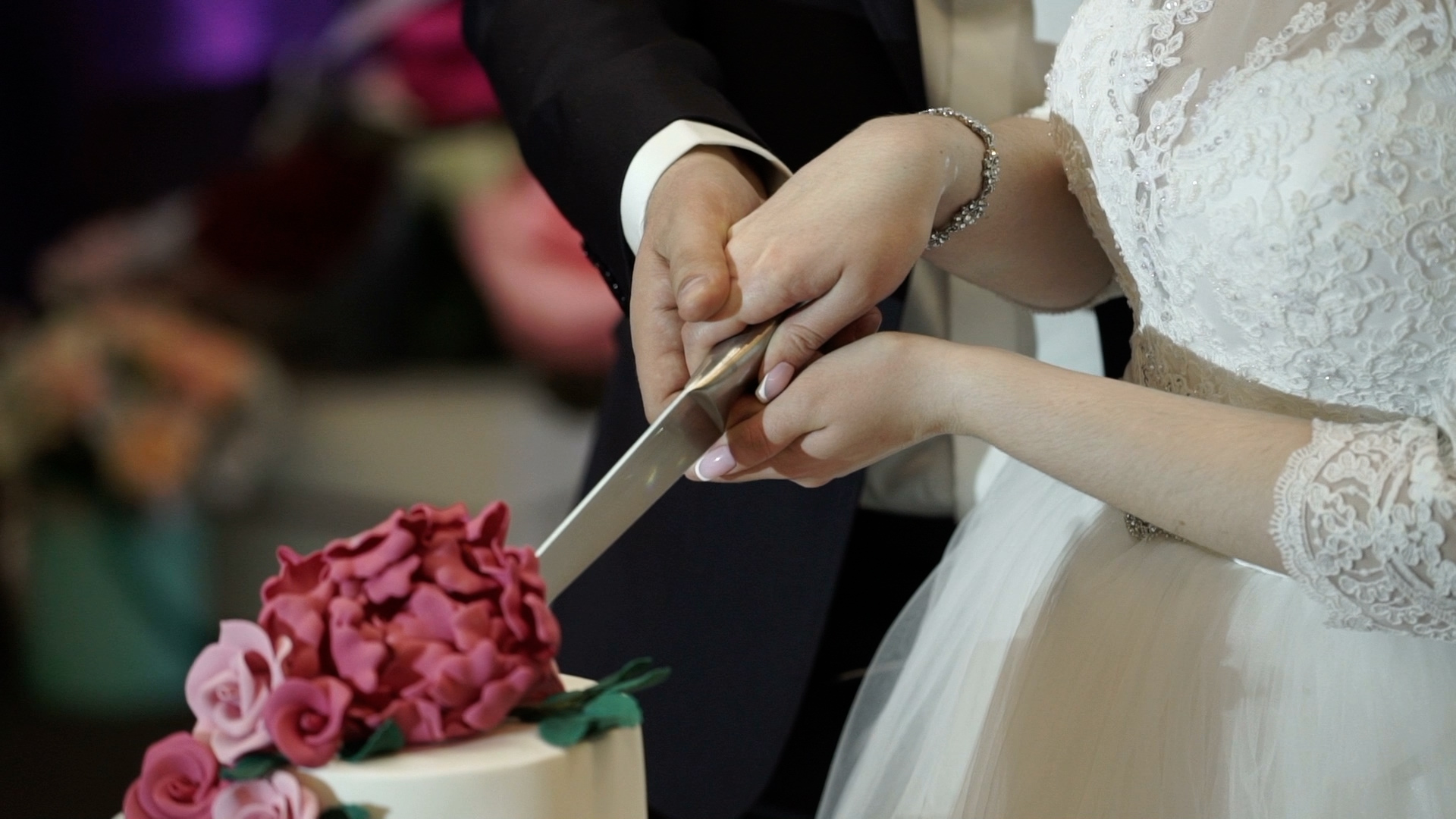 Couple cutting their wedding cake