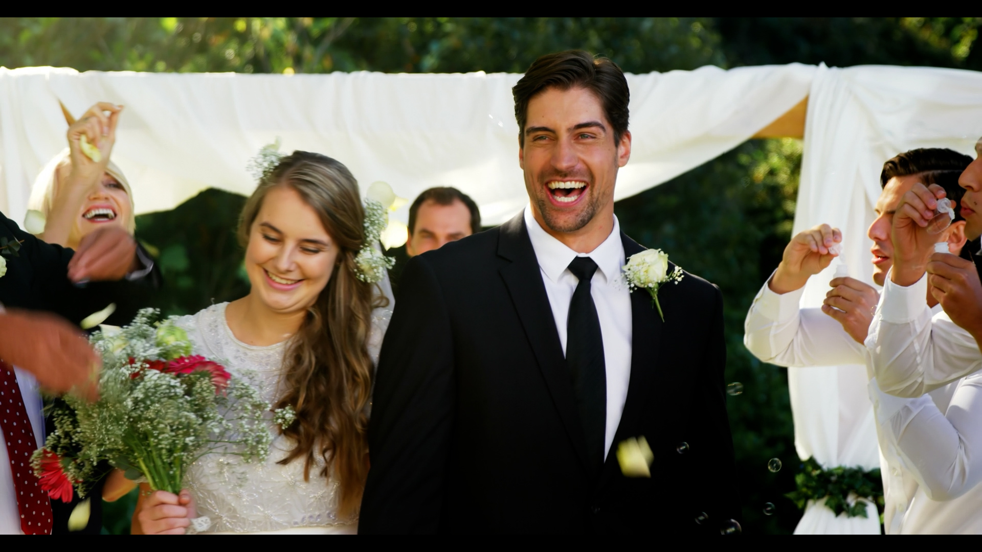 Happy couple celebrating with their guests