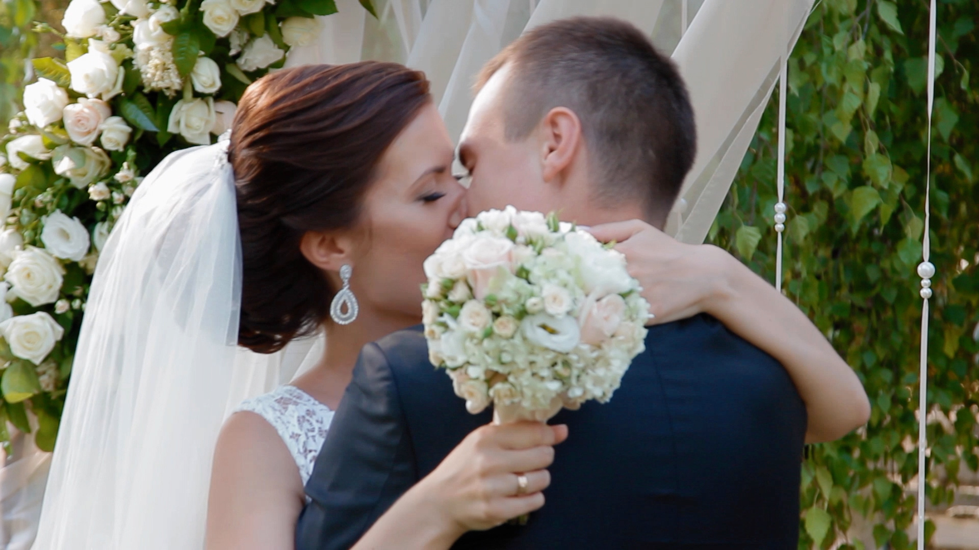 Newlyweds sharing a kiss after their ceremony